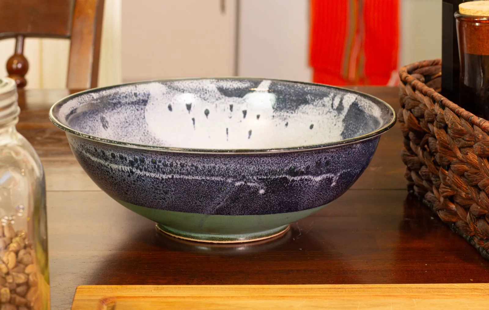 The bowl empty, showing the white glaze pooling across its interior and the pale green foot below.